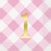 Gold number 1 on a pink and white gingham diamond patterned napkin.