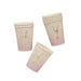 Three pink ombre paper cups with "Baby Girl" printed in gold script text, shown in different angles against a white background.
