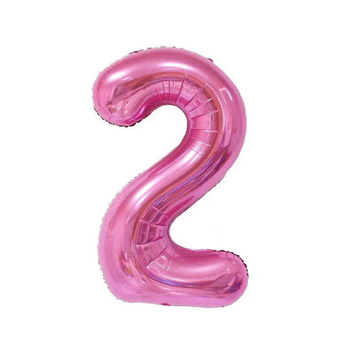 Pink foil number two balloon with a glossy metallic finish and curved shape against a white background.
