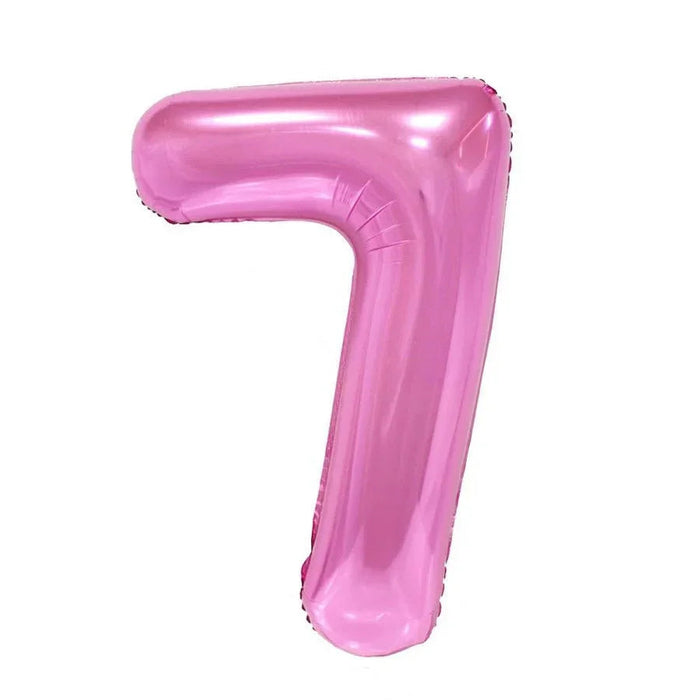Pink foil balloon shaped like the number 7 with a glossy finish and rounded edges.