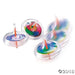 Three clear plastic spinning tops with colorful rainbow swirl patterns and red stems displayed in various spinning positions.