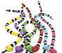 Twelve colorful plush toy snakes with segmented bodies in bright colors including yellow, purple, green, red, pink, and blue, each with a small plush head at one end.