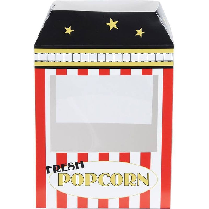 Red and white striped popcorn machine centerpiece with black roof, gold stars, film strip band detail, and "Fresh Popcorn" label on front window display.