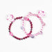 Two pink beaded bracelets with faceted crystal charms and dark red metallic spacer beads, displayed on a white background.