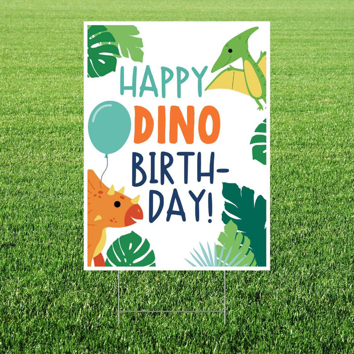 Colorful yard sign with "Happy Dino Birthday" text in teal and orange lettering, decorated with illustrated green dinosaurs, tropical leaves, a yellow flying pterodactyl, orange triceratops, teal balloon, and green foliage on white background.