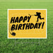 Yellow yard sign with white border featuring black text reading "Happy Birthday" and silhouettes of a hockey player and puck on a rink background.