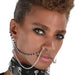 Silver-tone chain necklaces and a black studded choker with metal spikes and rings displayed on a model.