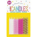Package of 24 spiral birthday candles in white, light pink, hot pink, and gold colors arranged in rows on a yellow background.