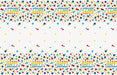 Plastic tablecover with white background and colorful polka dots in red, yellow, green, teal, and navy blue, featuring "Happy Birthday" text repeated along top and bottom borders.