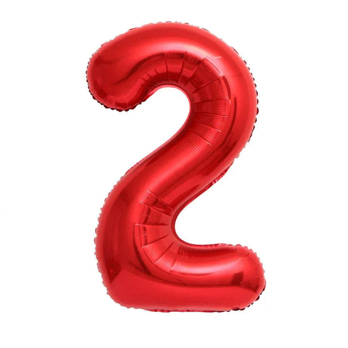 Red foil balloon shaped as the number 2, featuring a shiny metallic finish and standing upright against a white background.