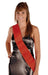 Woman wearing a black satin wrap dress with a red satin sash draped diagonally across the torso.