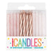 Box of 24 rose gold and white glitter spiral birthday candles with metallic rose gold twisted candles in the center displayed against a speckled pink and white background.