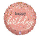 Rose gold round foil balloon with "happy birthday" text in white script and multicolored confetti dots including black, white, gold, and iridescent sparkles throughout.