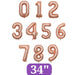 Rose gold foil balloons displaying digits 0 through 9 in 34-inch jumbo size, arranged in three rows with a purple label at the bottom.