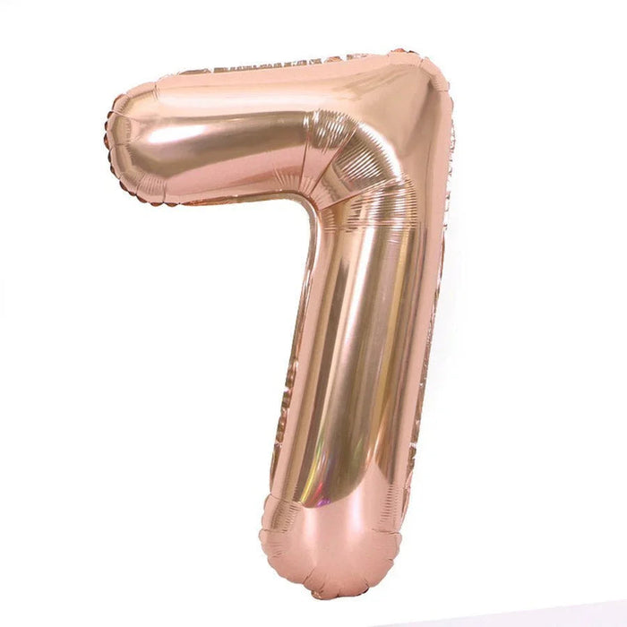Rose gold foil number 7 balloon with a shiny metallic finish and rounded rectangular shape against a white background.
