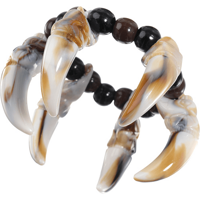 Beaded bracelet featuring four curved translucent animal tooth or claw pendants in cream and tan with black and brown spherical beads strung between them.