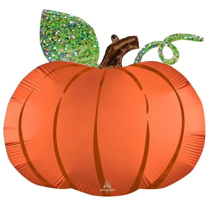 Orange satin pumpkin-shaped foil balloon with glittery green leaf and brown stem accents, featuring segmented ridges for dimensional appearance.