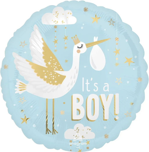 Light blue round mylar balloon featuring an illustrated white stork with gold-accented wings carrying a white egg, surrounded by gold and white stars and clouds, with white text reading "It's a BOY!