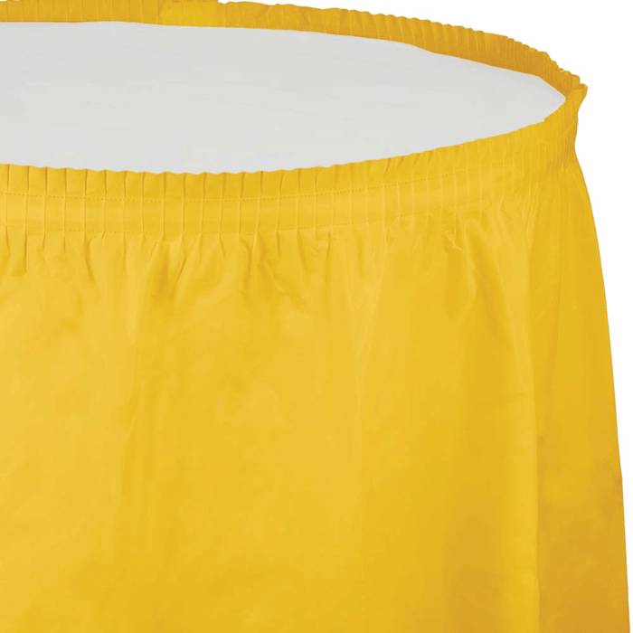Bright yellow plastic tableskirt with gathered elastic top band and plain white interior panel shown against white background.