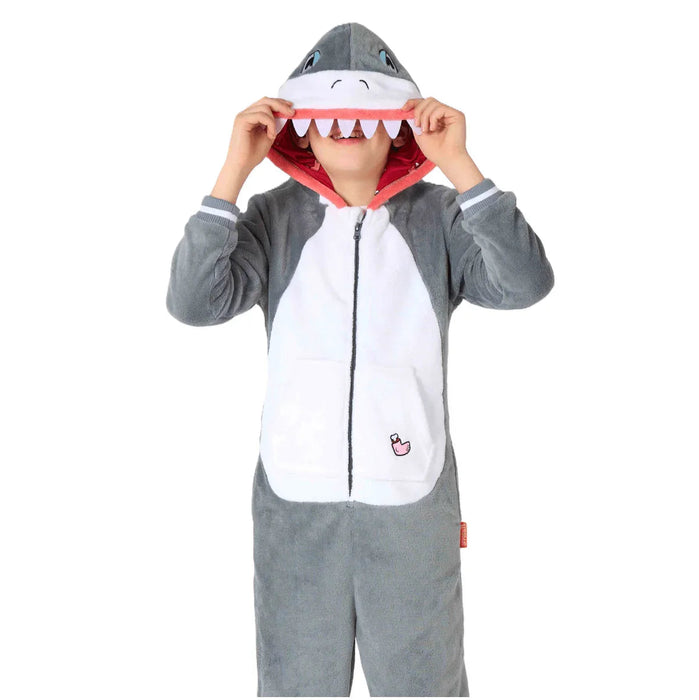 Child wearing a gray and white shark onesie costume with a red-lined mouth hood featuring white teeth and blue eyes.