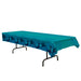 Teal plastic tablecloth featuring a repeating pattern of dark blue shark silhouettes along the bottom border, displayed draped over a black folding table.