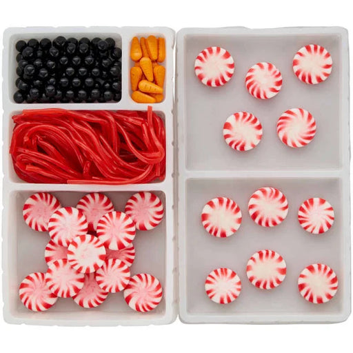 The contents of a package of Christmas Winter Snowman Cookie or Cupcake Decorating Kit, Decorates 12.