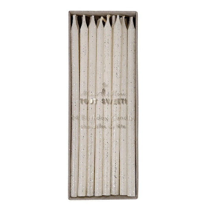 Box of 24 tall taper candles with cream-colored wax speckled with silver glitter, arranged upright in a cardboard sleeve.