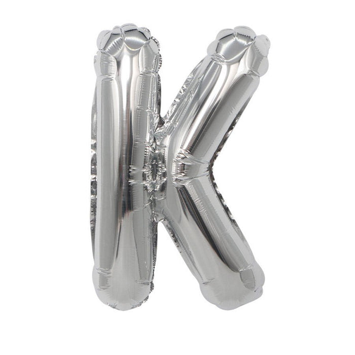 Silver metallic mylar balloon shaped like the letter K, displayed against a white background.