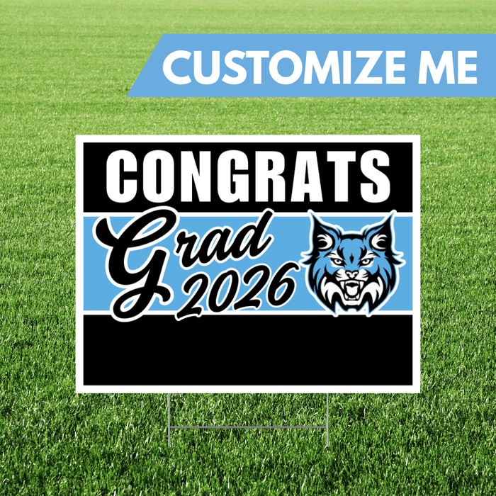 Graduation-themed sign with 'Congrats Grad 2026' on a grass background