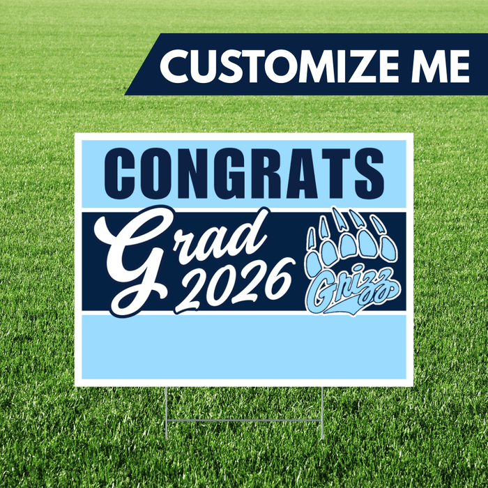 Graduation-themed sign with 'Congrats Grad 2026' on a grass background