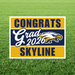 Yard sign with gold and navy blue horizontal stripes featuring "Congrats Grad 2026" text and an eagle logo for Skyline High School.