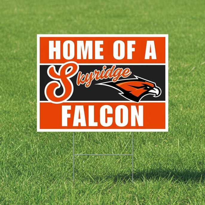 Rectangular yard sign with orange and black horizontal stripes featuring "HOME OF A" text at top, "Skyridge" script logo in center, a falcon head mascot in orange and black, and "FALCON" text at bottom.