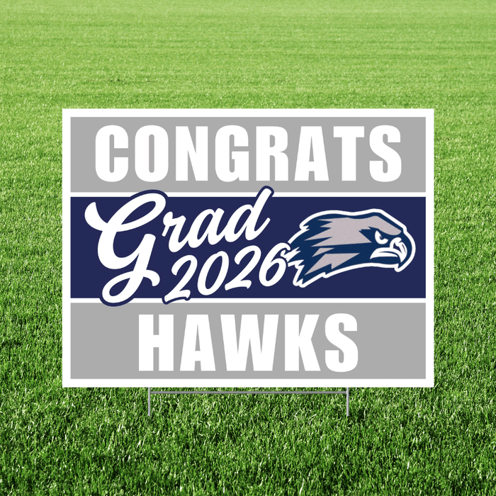 Yard sign with gray and navy horizontal stripes displaying "CONGRATS Grad 2026 HAWKS" text and a hawk mascot logo on green grass background.