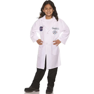 Child wearing a white lab coat with embroidered rocket and scientific icons over black pants and boots.