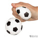Hand holding two white foam soccer balls with black pentagon panels, with a matching ball shown below.