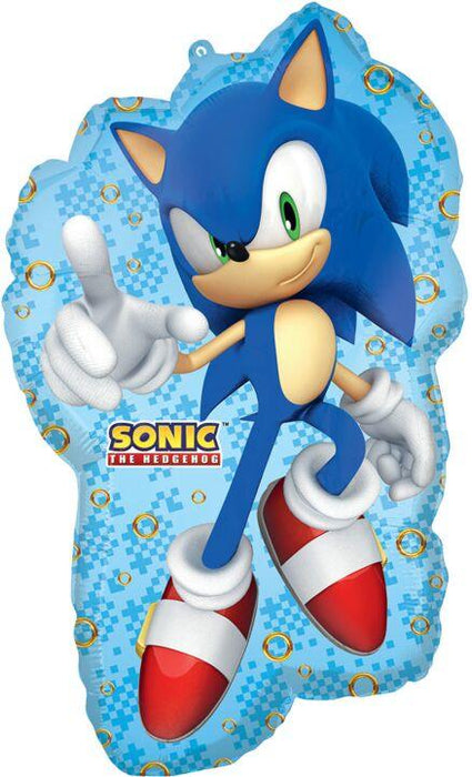 Blue mylar balloon shaped like Sonic the Hedgehog with his signature spiky hair, white gloves, red and white shoes, and a peace sign gesture, decorated with gold ring patterns on a light blue checkered background.