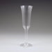 Clear plastic champagne flute with vertical ridged texture, tapered stem, and wide bowl, standing upright on a circular base against a neutral background.
