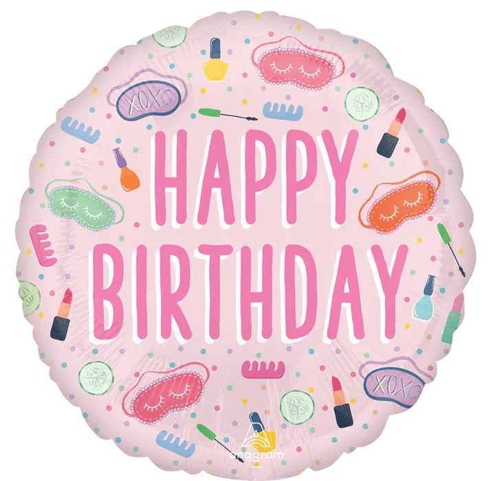 Round pink mylar balloon with "Happy Birthday" in large magenta letters surrounded by spa-themed icons including sleep masks, makeup brushes, nail polish, cucumbers, and cosmetic items in pastel colors.