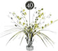 Black and silver foil balloon centerpiece with gold and silver star bursts radiating upward from a clear vase base, featuring a black "40" medallion at the top.