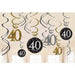Twelve hanging swirl decorations in gold, silver, and black featuring the number 40 for a 40th birthday celebration party.