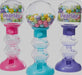 Three colorful gumball dispensers in pink, turquoise, and purple with clear globe tops filled with multicolored pearl-shaped candies and "Pearlee" branding visible on each.