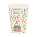 Cream-colored disposable cup printed with spring-themed illustrations including a pink cottage with green roof, pink bow, hopping rabbit, colorful flowers, and garden vegetables.