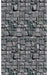 Seamless repeating pattern of gray and charcoal stone blocks arranged in a staggered brick-like layout with realistic shadows and texture detail.
