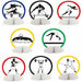 Eight honeycomb paper centerpieces featuring silhouettes of athletes in different sports including hurdles, gymnastics, swimming, weightlifting, and volleyball, each framed in colored rings of blue, black, red, yellow, and green.