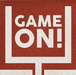 Rust-red napkins with white football goal post design and "GAME ON!" text printed in the center.