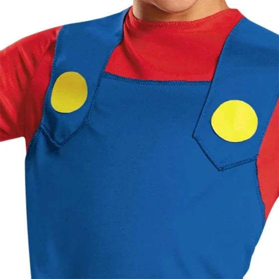Child wearing a blue overall costume with red shirt underneath, featuring two yellow circular buttons on the chest pockets.