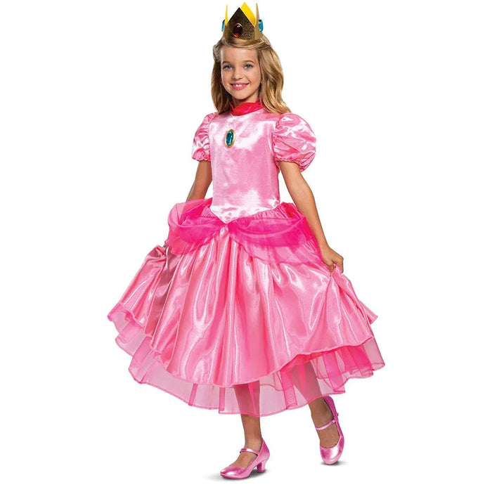 Child wearing a pink Princess Peach costume with a puffed short-sleeve top, layered tulle skirt, gold crown with jewels, red choker, and pink shoes.