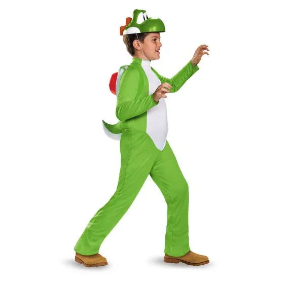 Child wearing a bright green Yoshi dinosaur costume with white belly, red shell backpack, green hood with brown horns, and brown shoes.