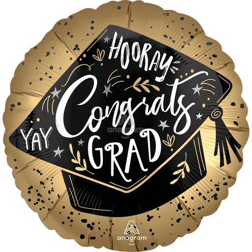 Gold and black graduation cap balloon with white and gold text reading "Hooray Congrats Grad" surrounded by stars and decorative flourishes.
