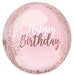 Pink oval foil balloon with "Happy Birthday" text in white and rose gold script, decorated with rose gold confetti dots around the edges.